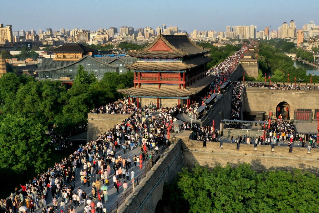 Tourists visit the ancient city wall in Xian, Shaanxi province in May. Domestic travel is bouncing back after pandemic restrictions were scrapped. Photo: Xinhua