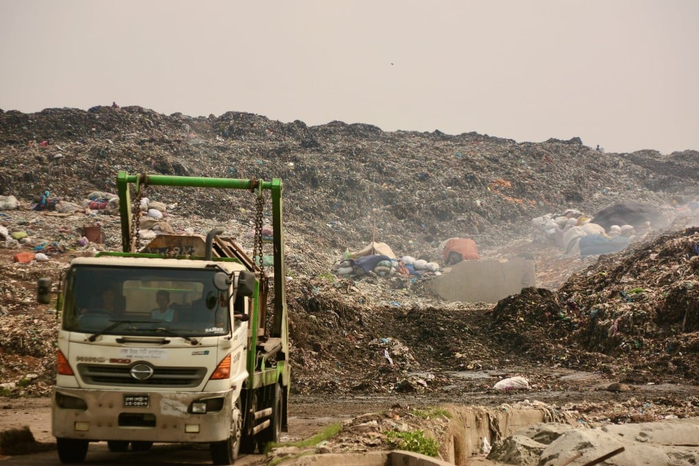A trash truck leaves the Aminbazar landfill site on the outskirt of Dhaka. Photo: Redwan Ahmed