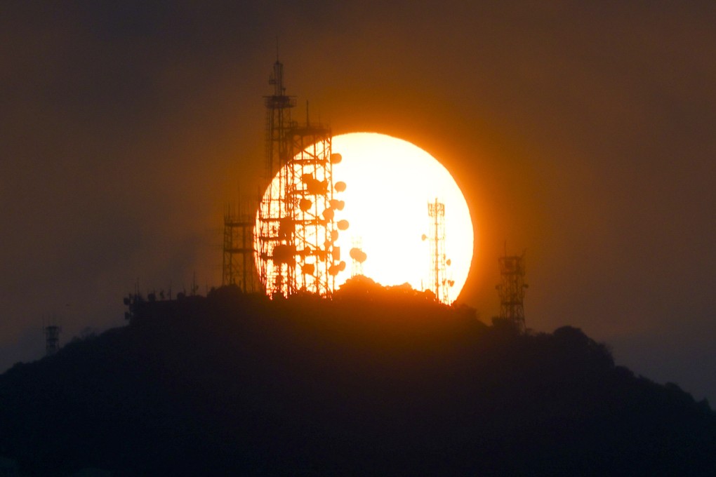 Sunset against Victoria Peak Radio Station. The Peak, with a height of 552 meters, is the highest mountain in Hong Kong Island. Photo: Dickson Lee