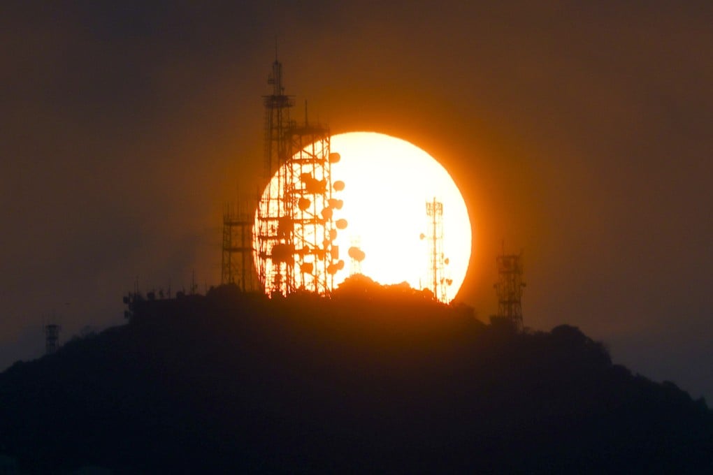 Sunset against Victoria Peak Radio Station. The Peak, with a height of 552 meters, is the highest mountain in Hong Kong Island. Photo: Dickson Lee