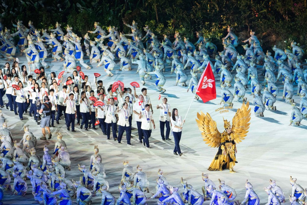 The Hong Kong delegation, led by flag bearer Vivian Kong, arrives at the opening ceremony for the Asian Games in Jakarta. Photo: Xinhua