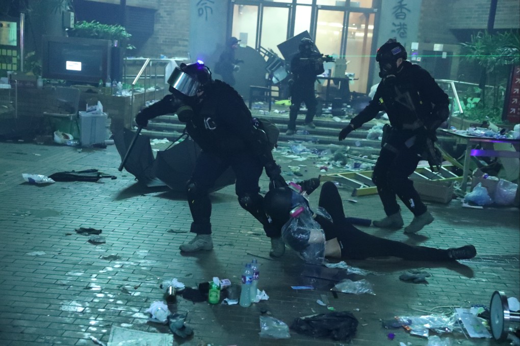 A protestor arrested by police officers at the height of the disturbances at the Polytechnic University campus. Photo: Sam Tsang