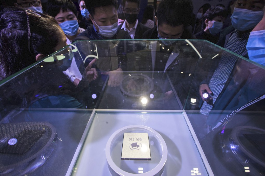 Visitors look at the Arm-based Yitian 710 server processor, developed by Alibaba’s T-Head unit, at the Apsara Conference, in Hangzhou, Zhejiang province, Oct. 19, 2021. Photo: Chinatopix via AP