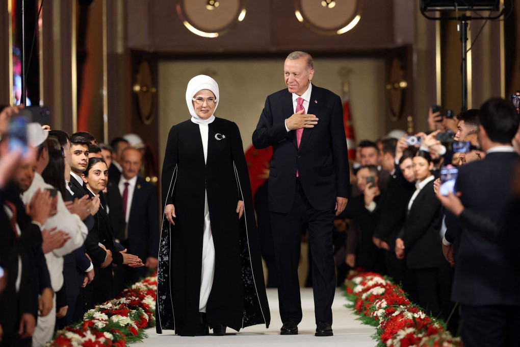 Turkish President Recep Tayyip Erdogan and his wife Emine Erdogan greet guests during his oath-taking ceremony at the Presidential Complex in Ankara, Turkey on Saturday. Photo: Handout / Press Office of the Republic of Turkey / AFP