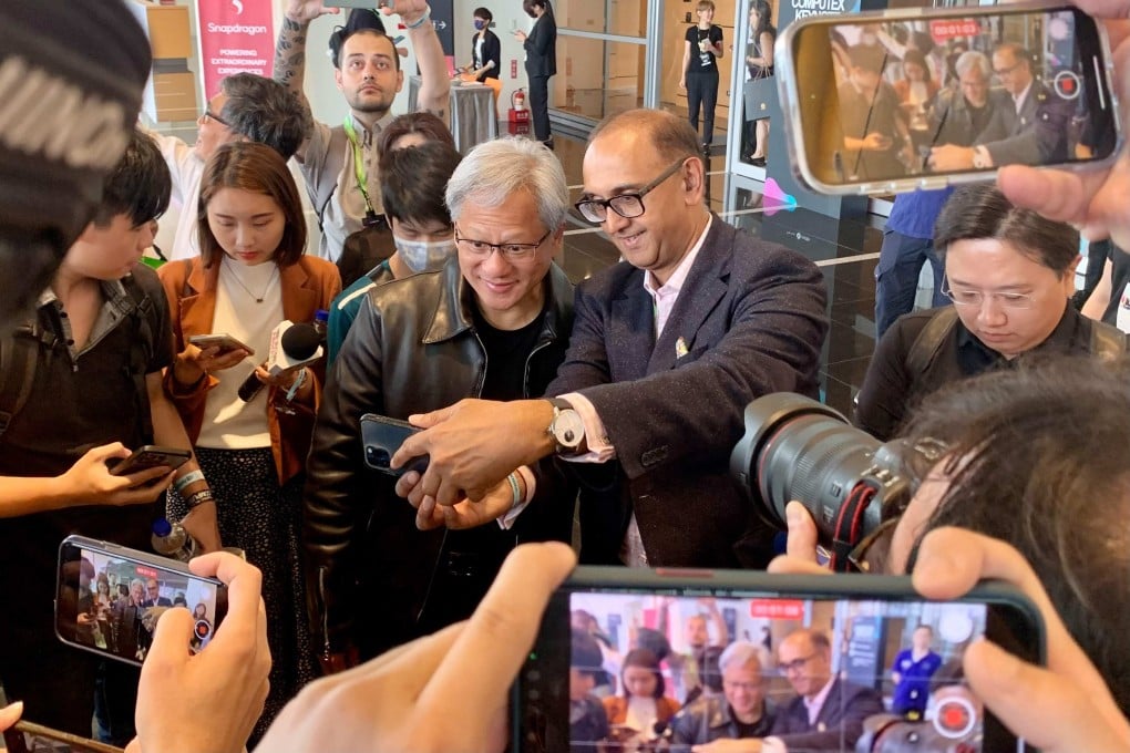 Nvidia chief Jensen Huang (centre L) poses for photographs before attending a press conference at Computex 2023 in Taipei. Photo: AFP