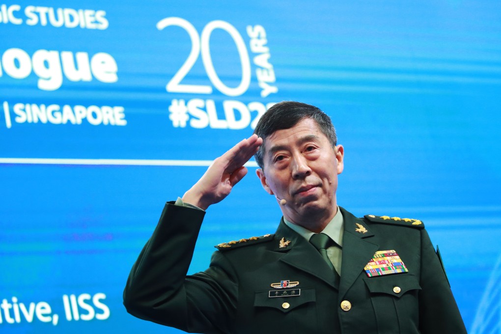 Chinese Defence Minister General Li Shangfu salutes before delivering his speech at the Shangri-La Dialogue in Singapore on Sunday. Photo: EPA