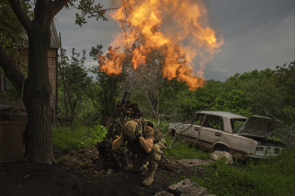 A Ukrainian soldier fires a mortar at Russian positions on the frontline near Bakhmut, in the Donetsk region, last week. Photo: AP