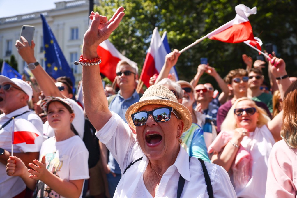 People attend an anti-government march on the 34th anniversary of Poland’s first postwar democratic election, in Warsaw, Poland on Sunday. Photo: Zuma Press Wire / dpa