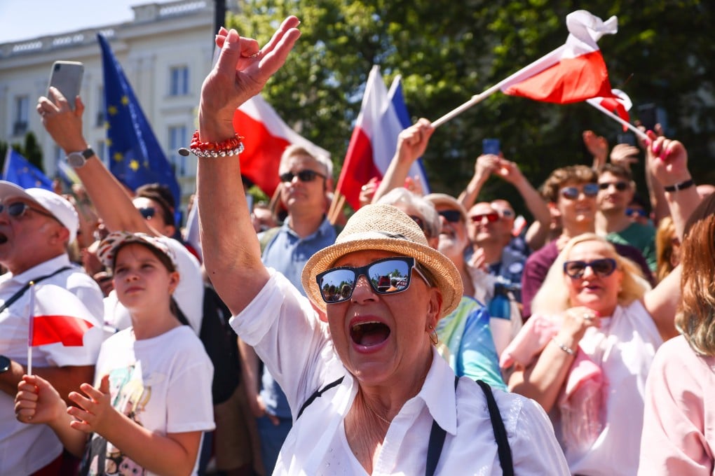 People attend an anti-government march on the 34th anniversary of Poland’s first postwar democratic election, in Warsaw, Poland on Sunday. Photo: Zuma Press Wire / dpa