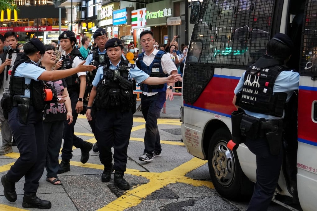 Mak Yin-ting, a veteran journalist and former chairwoman of the Hong Kong Journalists Association, is taken to a police van after she was detained in Causeway Bay, near the traditional site of the Tiananmen Square June 4 crackdown commemoration. Photo: Elson Li
