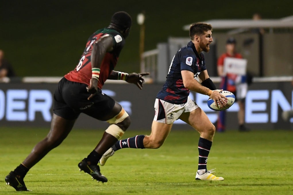 Hong Kong’s Gregor McNeish runs clear of Kenya’s George Nyambua during the Rugby World Cup 2023 Final Qualifcation Tournament at The Sevens Stadium in Dubai. Photo: World Rugby