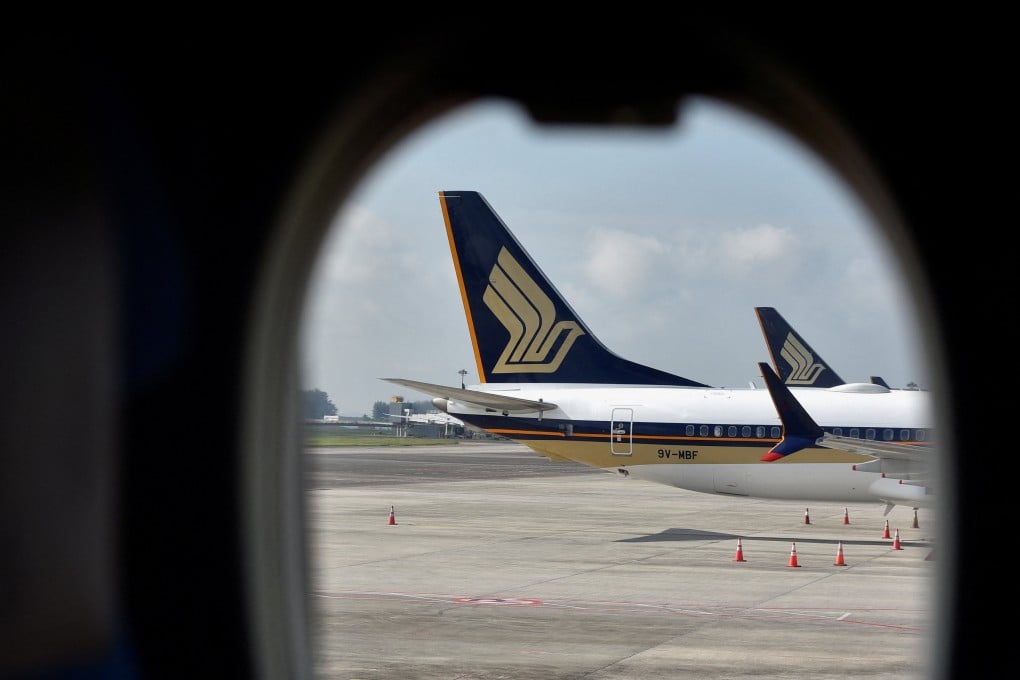 Singapore Airlines planes sit on the tarmac at Changi Airport. On most airlines, in-air internet typically remains exclusive to those who shell out for a first-class or business traveller seat. Photo: Reuters