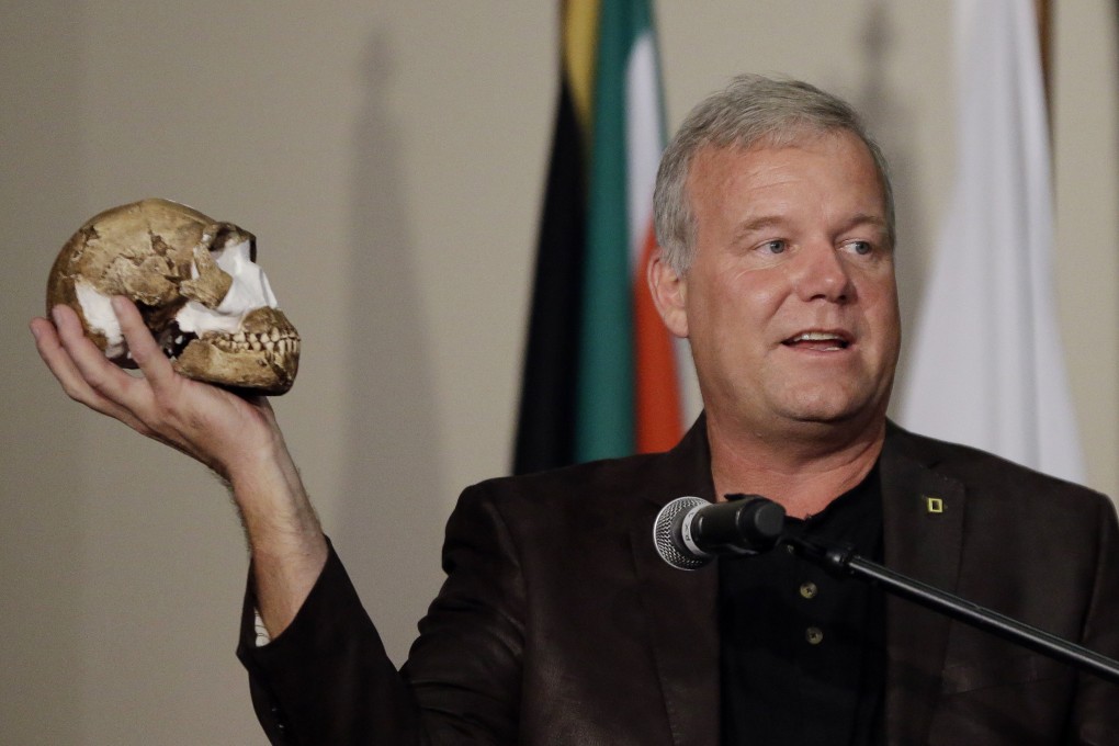 Researcher Lee Berger holds a reconstruction of the skull of Homo naledi at Magaliesburg, South Africa in September 2015. Photo: AP