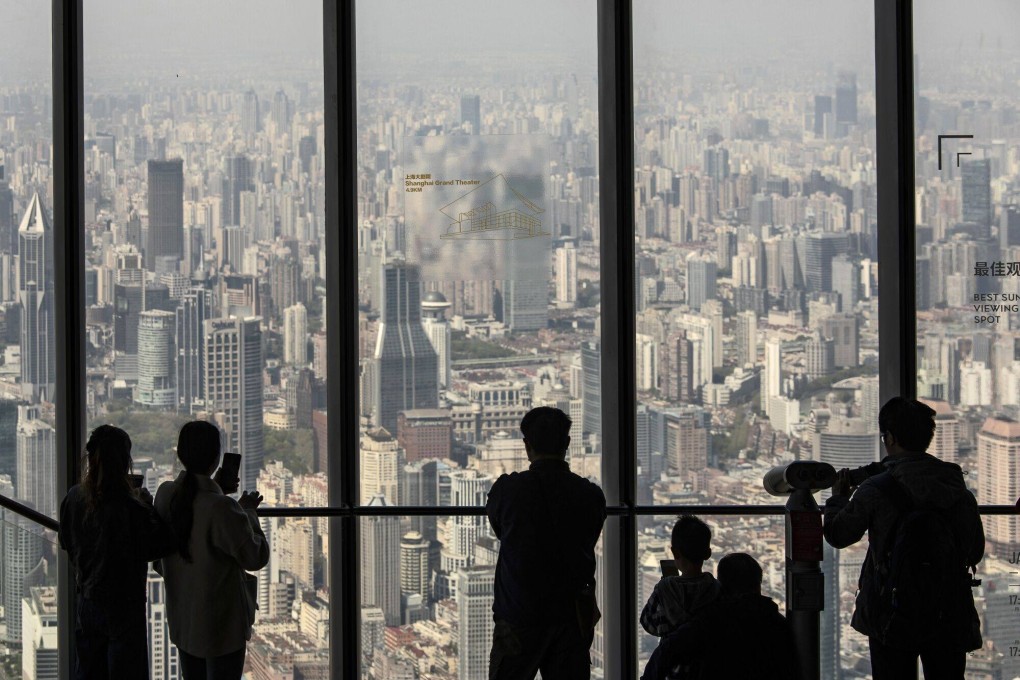Visitors admire the view of Shanghai, China’s global trade hub. Despite the country’s restoration of normal commercial life, the value of exports in May this year fell from a year ago, pointing to a stalled economic recovery. Photo: Bloomberg