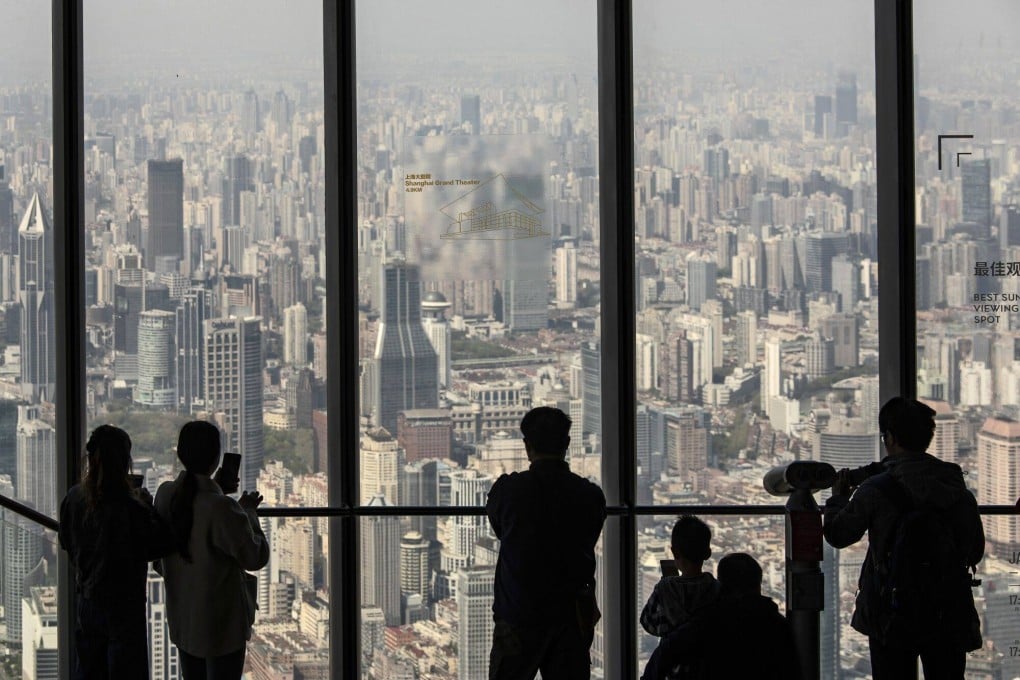 Visitors admire the view of Shanghai, China’s global trade hub. Despite the country’s restoration of normal commercial life, the value of exports in May this year fell from a year ago, pointing to a stalled economic recovery. Photo: Bloomberg