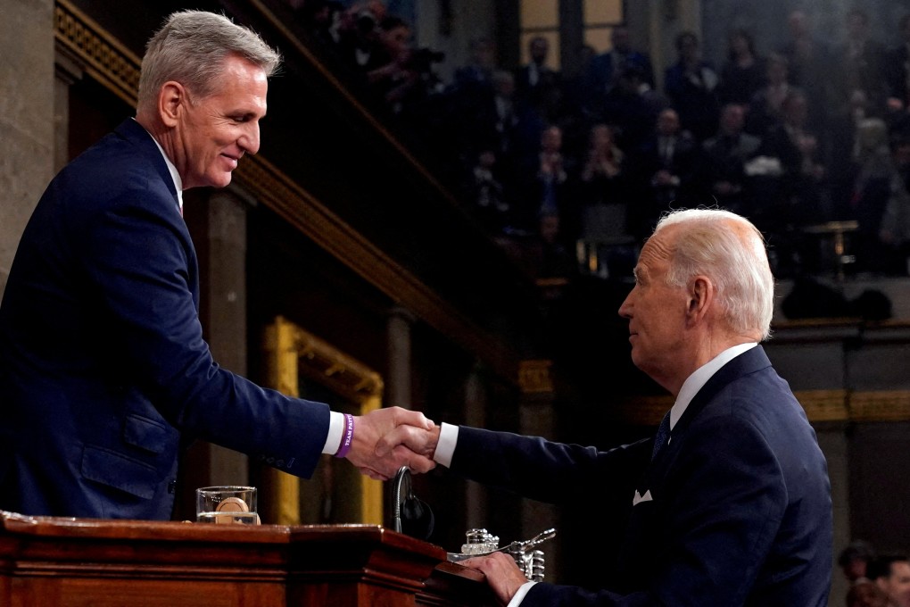 House Speaker Kevin McCarthy (left) shakes hands with US President Joe Biden after the State of the Union address to a joint session of Congress at the Capitol in Washington on February 7. Biden has praised McCarthy for his role in negotiations over the US debt ceiling despite the economic disruption and loss of global standing it brought the country. Photo: Reuters