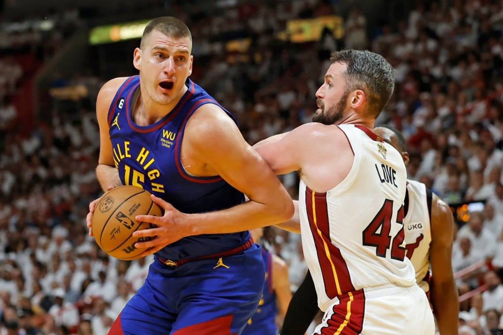 Nikola Jokic (left) of the Denver Nuggets drives against the Miami Heat’s Kevin Love during Game 3. Photo: TNS