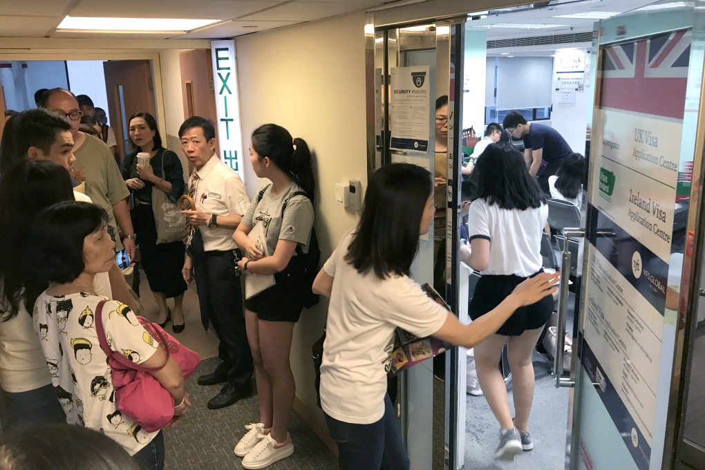 Students and their families queue at the UK Visa Application Centre in Causeway Bay, Hong Kong, on September 4, 2017. Britain’s Conservative-led government is targeting international students as a way to reduce immigration despite the key role they play in funding British universities and bringing talent into the country. Photo: Nora Tam