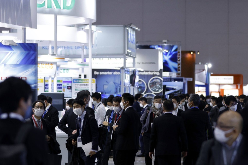 Visitors view chip production equipment at the SEMICON Japan exhibition in Tokyo, December 14, 2022. Photo: Bloomberg