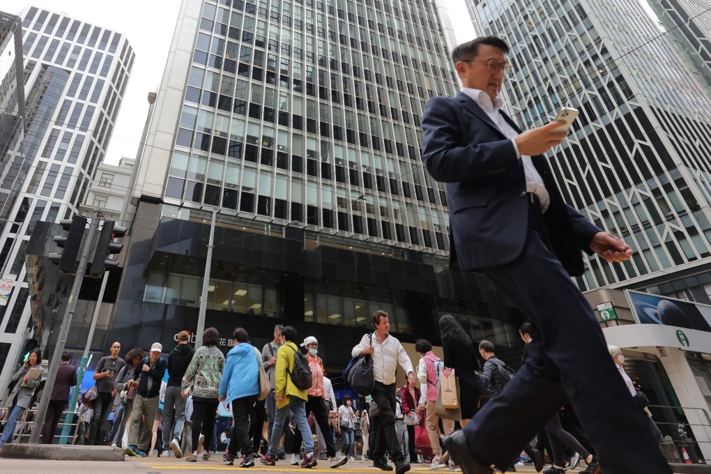 People crossing the road in Central on April 11. While most economies in East Asia are reluctant to search further afield, the uncomfortable reality is that only India and Pakistan are likely to generate a steady flow of migrant workers. Photo: Jelly Tse