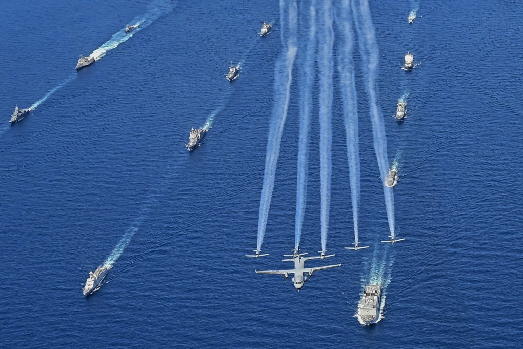 Indonesian Navy aircraft fly over warships taking part in the 4th Multilateral Naval Exercise Komodo 2023. Photo: AP