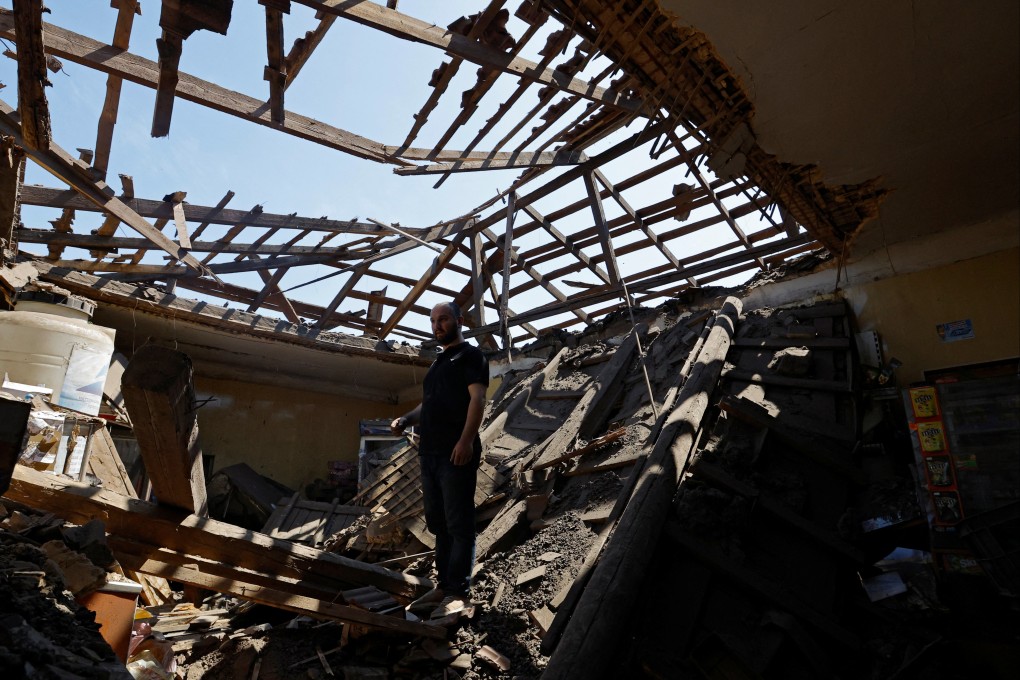 A man stands inside a shop destroyed by recent shelling in the course of Russia-Ukraine conflict, in Makiivka (Makeyevka) outside Donetsk, Russian-controlled Ukraine, on June 2, 2023. Photo: Reuters