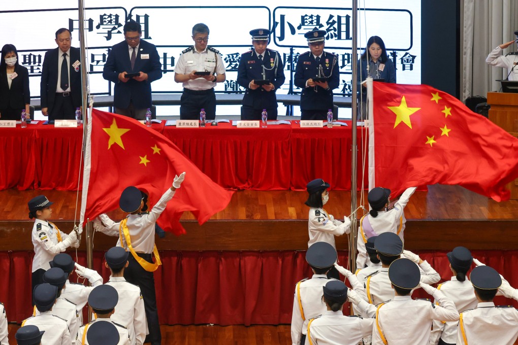 Students take part in a patriotic event in May, attended by Commissioner of Police Raymond Siu (centre left). Photo: Jonathan Wong