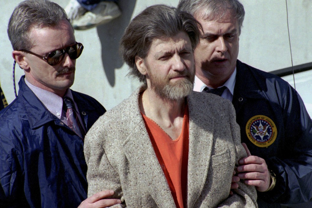 Unabomber Theodore “Ted” Kaczynski is flanked by federal agents in Helena, Montana, US in 1996. He died in prison on Saturday at the age of 81. Photo: AP