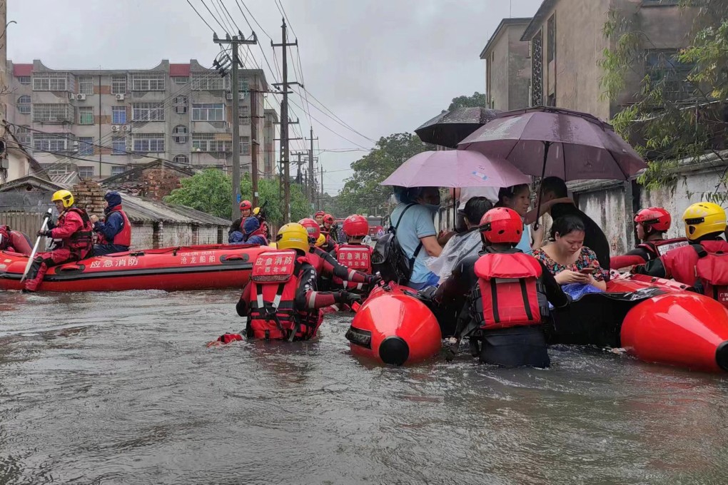 Rescue workers evacuate residents on a flooded street in Beihai, Guangxi Zhuang autonomous region on Thursday. Photo: via Reuters