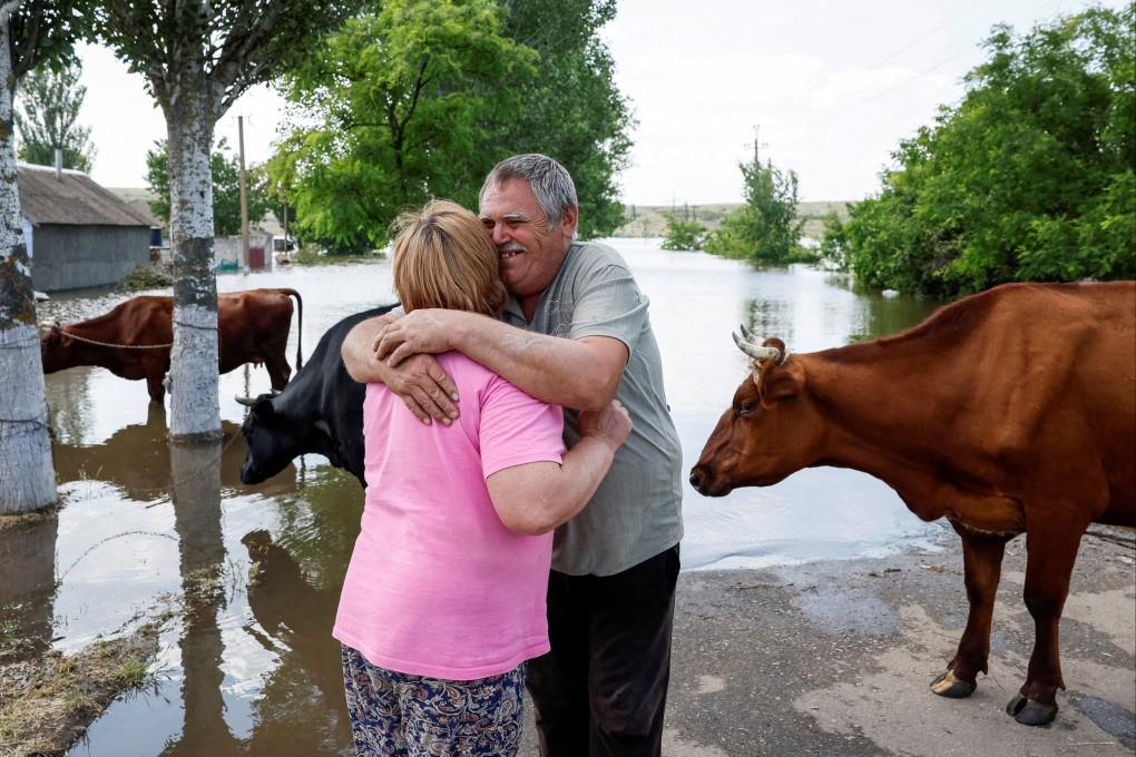 Residents wait for a barge to evacuate their cows from the village of Afanasiivka, which was partly flooded after the Nova Kakhovka dam breached, amid Russia’s attack on Ukraine. Photo: Reuters