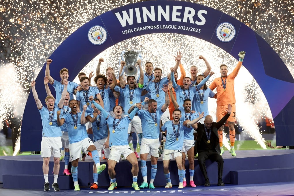 Manchester City captain Ilkay Gundogan raises the trophy after his club’s Champions League triumph. Photo: EPA-EFE