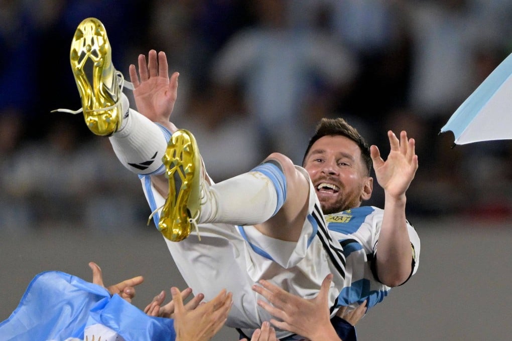 Argentina’s forward Lionel Messi is thrown up in the air by teammates during a recognition ceremony for World Cup winning players in March. Photo: AFP
