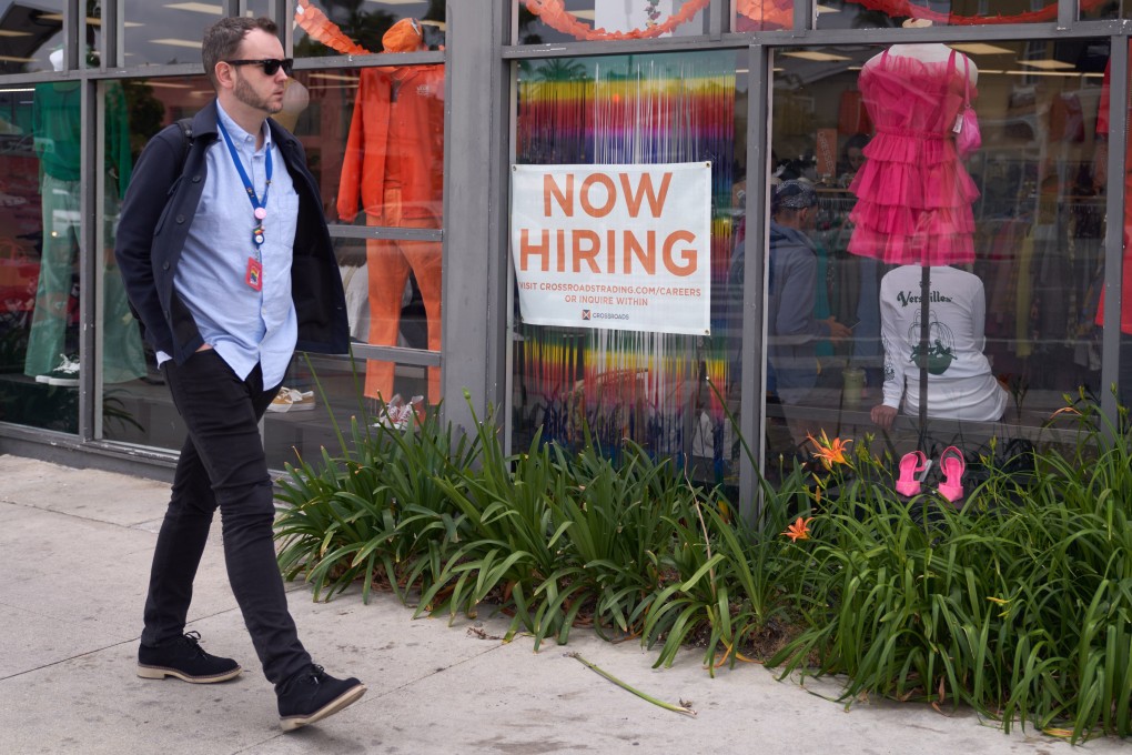 A man walks by a job advert in the window of a business in Los Angeles on June 6. The recent US Bureau of Labor report showed the public and private sector added 339,000 jobs in May despite the Federal Reserve’s aggressive interest rate increases in an attempt to lower inflation.  Photo: EPA-EFE