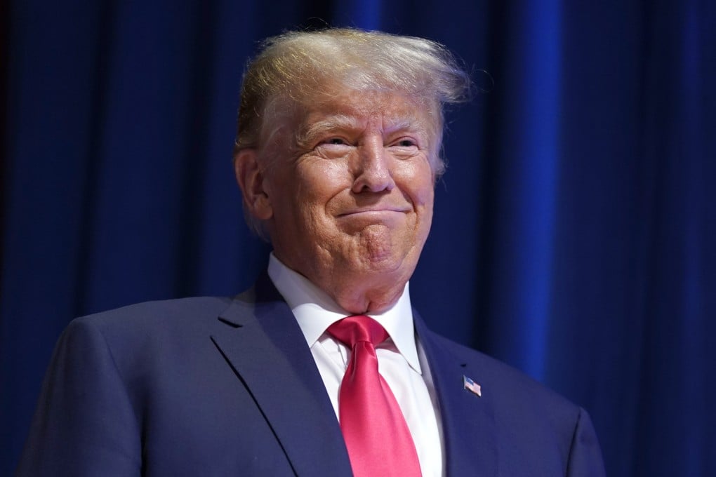 Donald Trump smiles as he arrives on stage to speak during the North Carolina Republican Party Convention on Saturday. Photo: AP