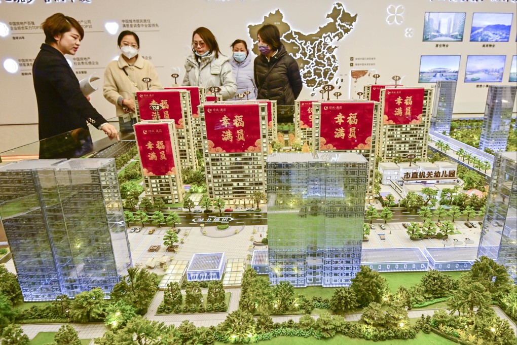 Homebuyers view a scale model of a residential project in Qingzhou, in eastern Shandong province. Photo: CFOTO/Future Publishing via Getty Images
