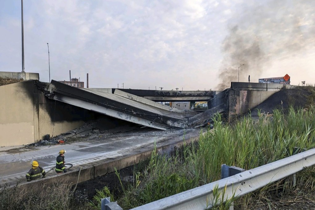 Firefighters stand near the collapsed part of highway I-95 in Philadelphia, Pennsylvania on Sunday. Photo: Office of Emergency Management via AP
