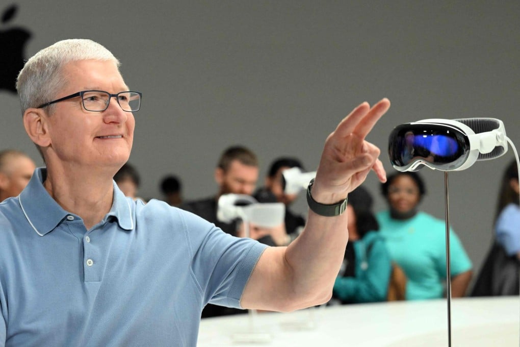 Apple chief executive Tim Cook gestures to members of the media next to the new Vision Pro mixed-reality reality headset during the company’s Worldwide Developers Conference, held at the Apple Park campus in Cupertino, California, on June 5, 2023. Photo: Agence France-Presse