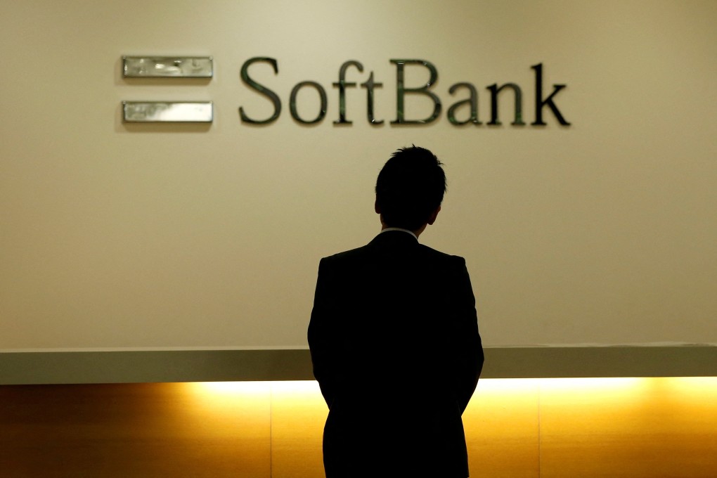 A man looks at the logo of SoftBank Group Corp at the company’s headquarters in Tokyo on June 30, 2016. Photo: Reuters