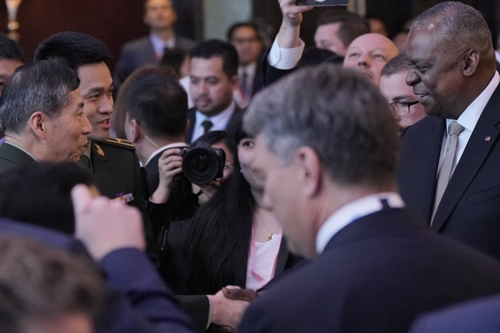 US Defence Secretary Lloyd Austin (right) shakes hands with Chinese Defence Minister Li Shangfu (left) at the opening dinner of the Shangri-La Dialogue in Singapore on June 2. Photo: AP
