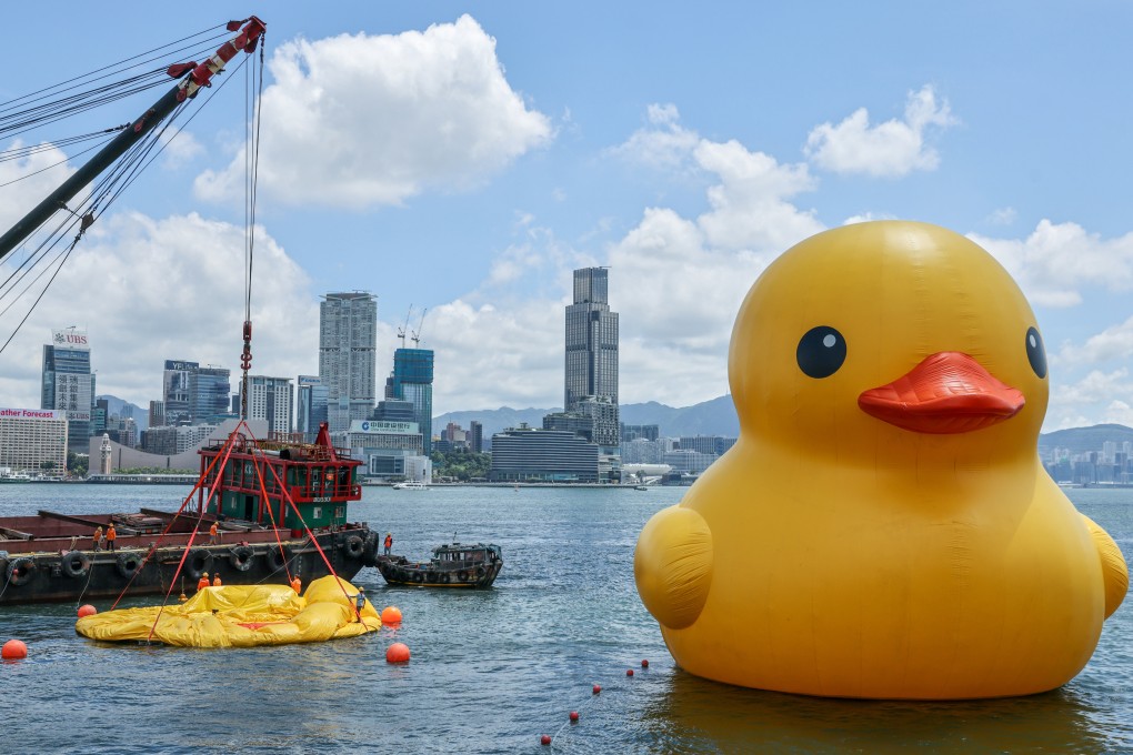 A deflated giant rubber duck has sprung back to Tamar and has been reunited with its twin at the Central harbourfront, two days after withering in Hong Kong’s sweltering heat. Photo: May Tse