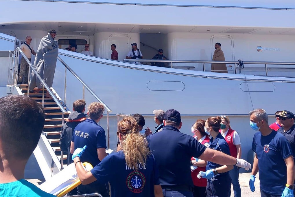 Paramedics of the Greek National Emergency Ambulance Service and members of the Greek Red Cross helps migrants upon arrival to the Kalamata’s port, Greece. Photo: EPA-EFE