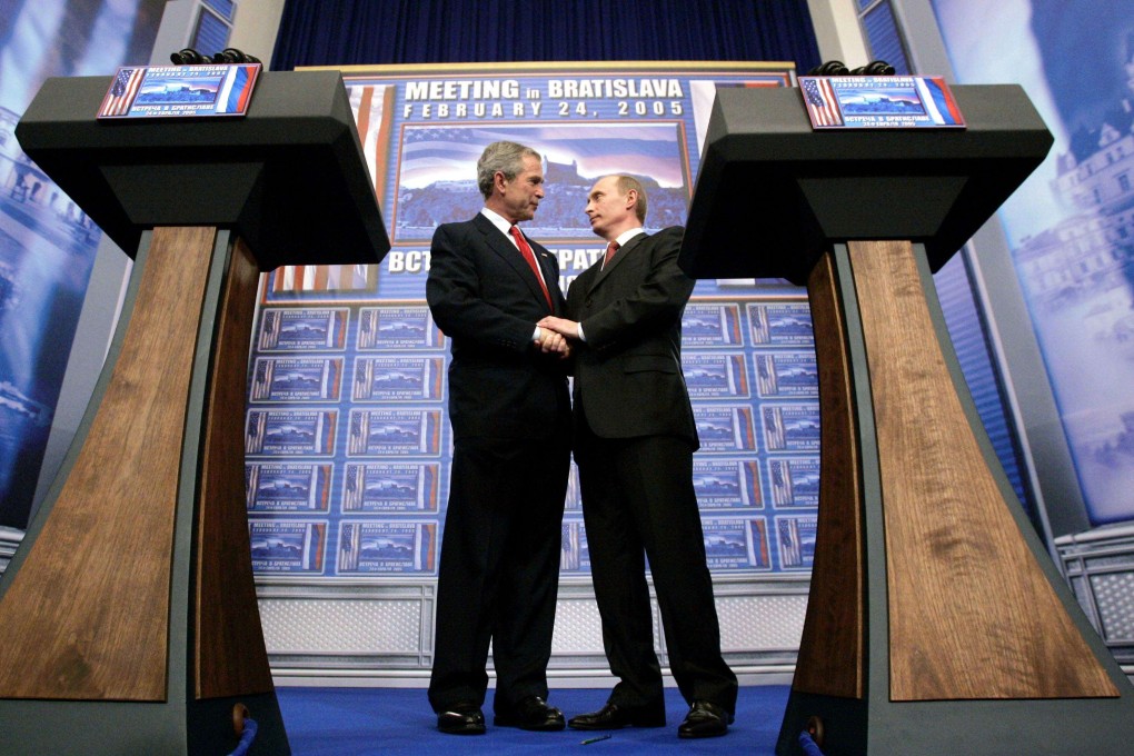 Then US president George W. Bush and Russian President Vladimir Putin clasp hands after conducting a joint press conference at Bratislava Castle in Slovakia, on February 24, 2005. While US-Russia tries have deteriorated in recent years, Putin was the first international leader to call Bush after the September 11 attacks. Photo: Reuters
