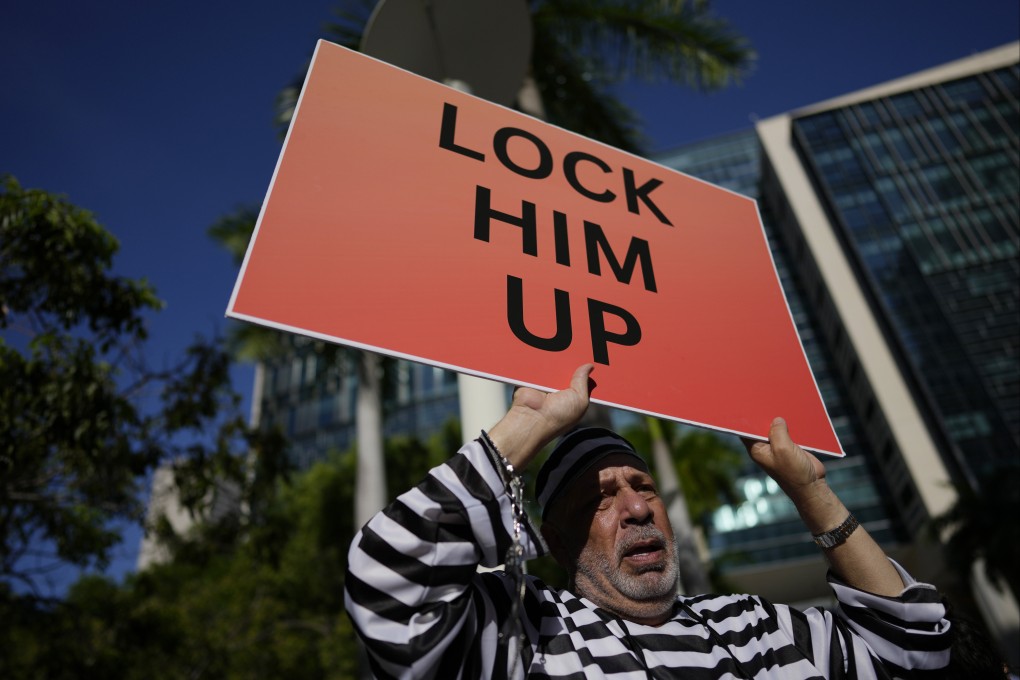 A protester outside the Wilkie D. Ferguson Jnr Courthouse in Miami, where Donald Trump’s arraignment was on Tuesday. Photo: AP