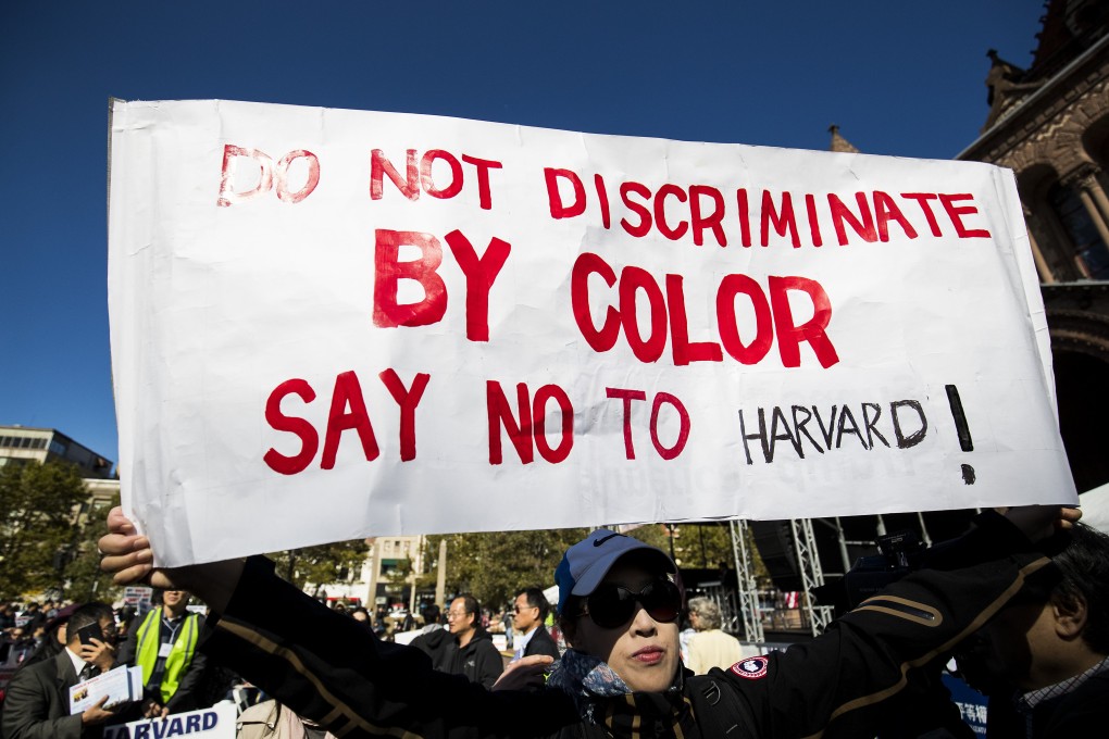 An opponent of Harvard’s admission policies attends a protest in Boston. Photo: Bloomberg
