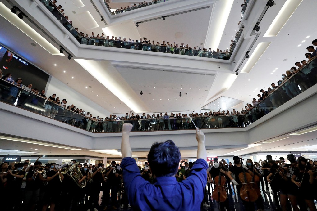 A group of music performers plays the song “Glory to Hong Kong” during a protest at a shopping mall in Hong Kong’s Kowloon Tong district, on September 18, 2019. Lawyers and academics have warned that the government’s bid to get a court ban on the song will have a major impact on the city’s freedom of information. Photo: Reuters