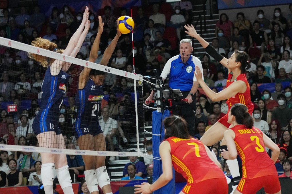 China’s Gong Xiangyu spikes the ball as Italy’s defenders move to block it at the net. Photo: Elson Li