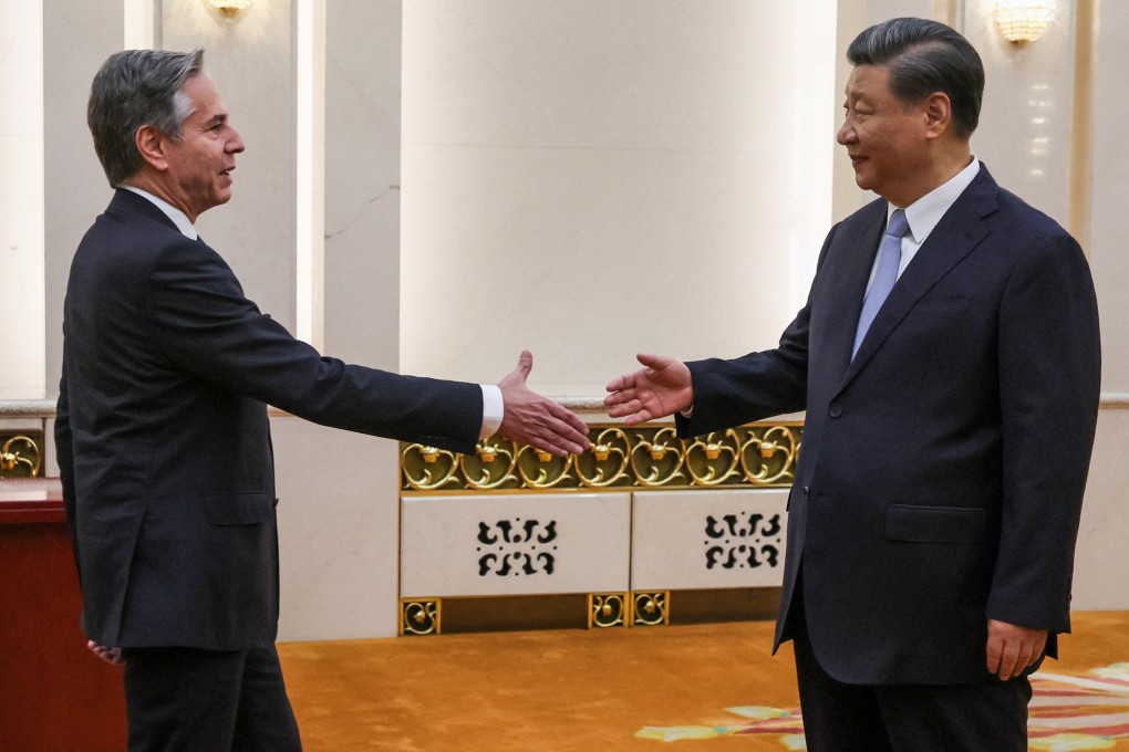 Chinese President Xi Jinping (right) greets US Secretary of State Antony Blinken in the Great Hall of the People in Beijing on Monday. Photo: Reuters