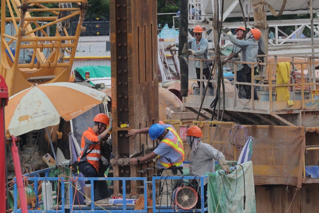Workers at a construction site in Central on June 13. The construction sector, like others, is suffering from a shortage of labour. Photo: Jelly Tse