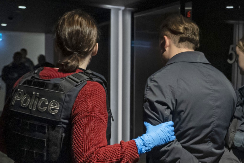 A suspect is taken into custody by the Australian Federal Police last week. Police said a Mexican crime syndicate sent 375kg of methamphetamine, also known as meth or Ice, in five shipments from April 2022 to February this year. Photo: Australian Federal Police via AP