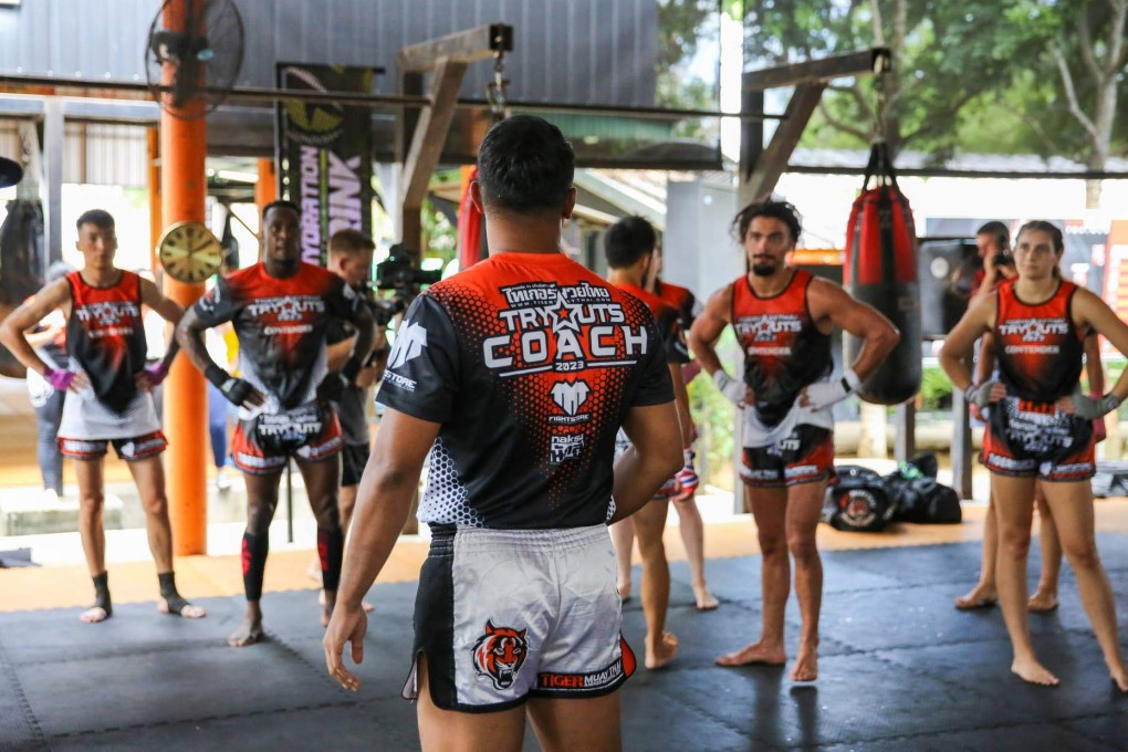 Athletes listen to their coach at the 2023 Tiger Muay Thai tryouts in Phuket, Thailand. Photo: Hip.jpeg